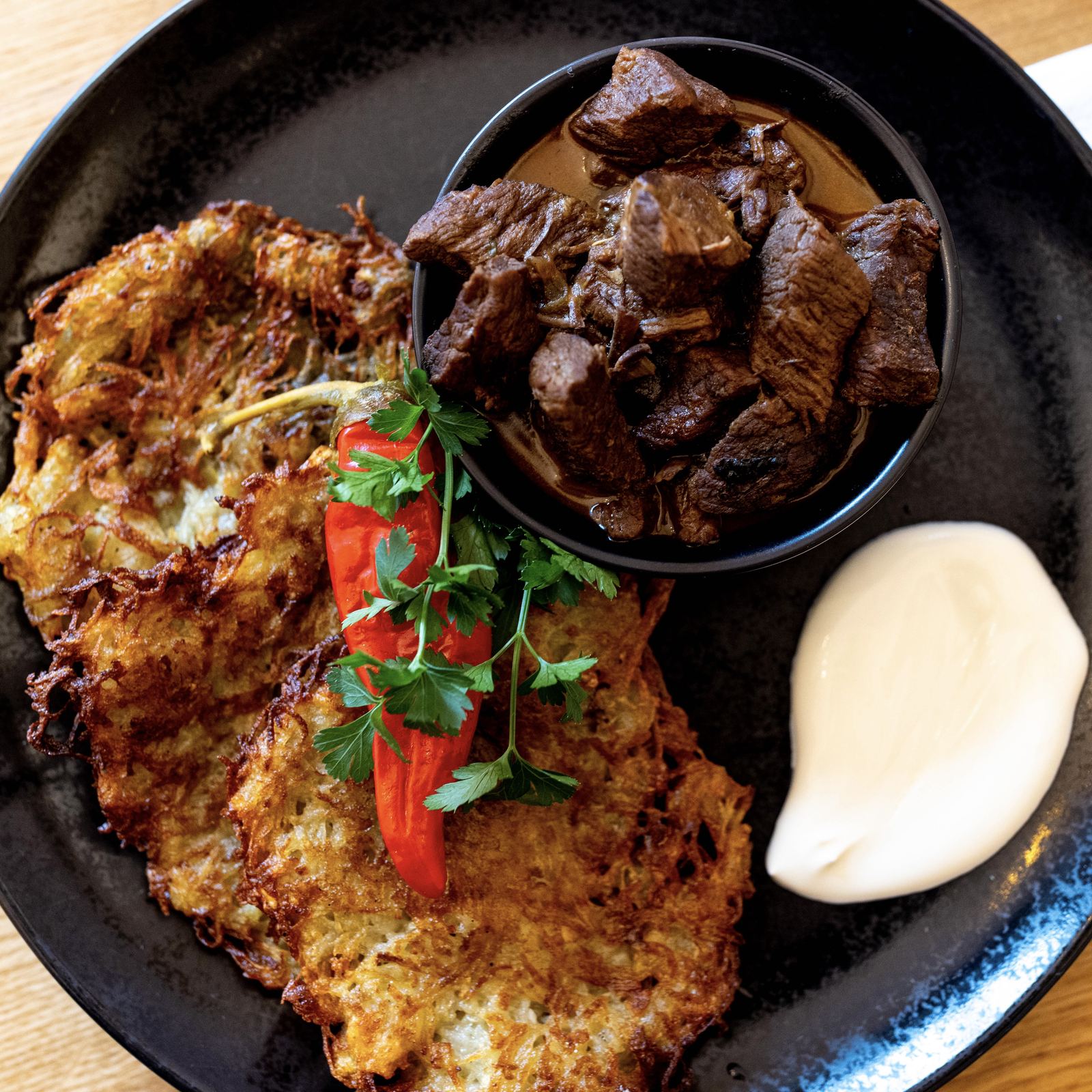 Potato pancakes with goulash